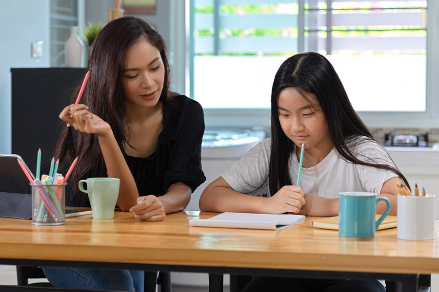 student and tutor together at a desk in Pittsburgh